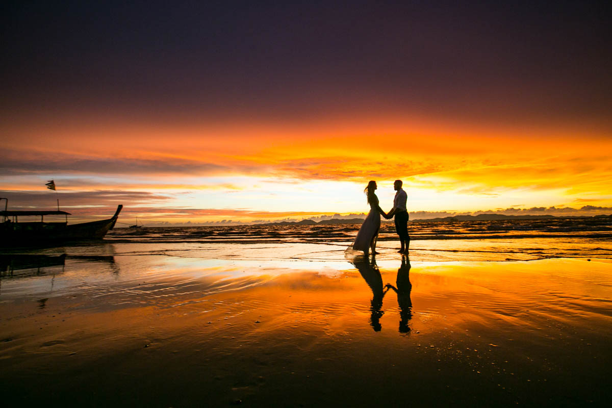 Honeymoon photography for Mike with Justine on beauiful beach during sunset Krabi Thailand.